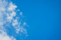 Bright blue sky with white clouds. Place for text on a blue background Royalty Free Stock Photo