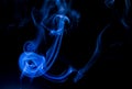 Bright blue smoke with black background