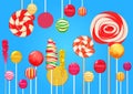 Bright blue sugar background with bright colorful lollipops candy sweets. Candy shop. Sweet color lollipop