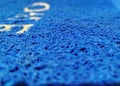 The bright blue welcome mat is a vermicelli noodle doormat