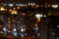 Bright blurred city landsape. Raining at night. Royalty Free Stock Photo