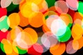 Bright blurred festive and colorful Christmas lights abstract background texture.