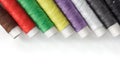 Bright bobbin thread on white Royalty Free Stock Photo