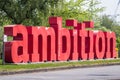 Ambition sculpture in bright red bold letters in manchester england