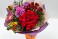 Bright bouquet red, yellow, green, lilac of roses, gerberas, alstroemeria and greenery Royalty Free Stock Photo