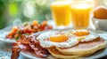 Bright breakfast scene with pancakes, bacon, eggs, and a glass of orange juice Royalty Free Stock Photo