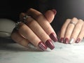 Bright Burgundy manicure with silver design.