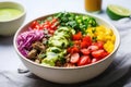 bright burrito bowl with tangy, spicy lime sauce