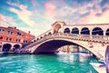 Bright charming landscape with Rialto Bridge at sunset in Venice, Italy. Amazing places. Popular tourist atraction