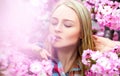 Bright charming woman with flower in mouth