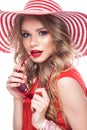 Bright cheerful girl in summer hat, colorful make-up, curls and pink manicure. Beauty face. Royalty Free Stock Photo