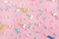 Bright pattern. Stationery chaotically scattered on a pink background. Staples, asterisks, clothespins and buttons are Royalty Free Stock Photo