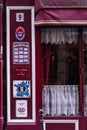 Bright cherry facade of a traditional French cuisine establishment