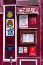 Bright cherry facade of a traditional French cuisine establishment