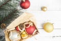 Bright Christmas background with red and gold xmas toys in box