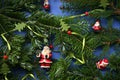 Christmas background with Santa Claus figures among fir branches Royalty Free Stock Photo