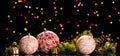 Bright Christmas balls with lace, small gifts and pine branches with cones, on the dark background Royalty Free Stock Photo