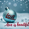 bright christmas holidays background with xmas ornament on snow written love is beautiful. Royalty Free Stock Photo