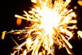 Bright Christmas sparkler closeup on a black background, soft focus Royalty Free Stock Photo