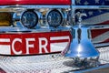 Bright chrome and brass bell, eagle on the front of a fire truck and front lights. Patriotic flag is painted on front gril