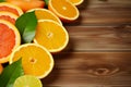 Bright citrus fruits pop against a clean white wooden background