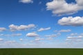 bright clean blue puffy clouds sky green farm pasture agricultural nature background