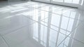 Bright and Clean Polished White Tile Floor Reflecting Sunlight from Windows in a Modern Interior Royalty Free Stock Photo