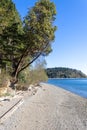 bright clear blue skies over a rocky beach Royalty Free Stock Photo