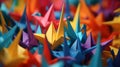 A bright close-up of Origami paper crane birds, a Japanese practice that involves folding intricately folded paper into a variety