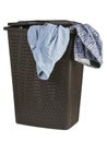 Bright clothes in a laundry closed basket Royalty Free Stock Photo