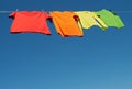 Bright clothes on a laundry line Royalty Free Stock Photo