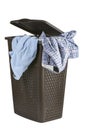 Bright clothes in a laundry open basket Royalty Free Stock Photo