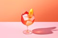 Bright and cocktail image of peach spritzer against the background in the color of apricot crush . Close-up. Generative