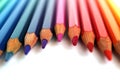 Bright color pencils horizontal wave on white background with violet central pencil on focus Royalty Free Stock Photo