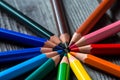 bright color pencils lie on a wooden table forming a circle Royalty Free Stock Photo
