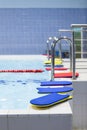 Bright color swimming boards at edge of children pool