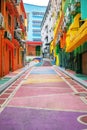 Bright colored backstreet with walls painted in graffiti style. Modern urban environment Royalty Free Stock Photo