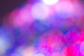 Bright colored blurry round spots of cool shades for a vivid purple background