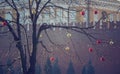 Bright colored Christmas decorations on a defoliated tree in Mos