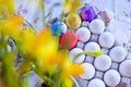 Bright colored eggs, large and small for Easter Sunday. Traditional treats. Copy space. Background of colored eggs Royalty Free Stock Photo