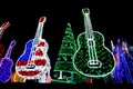 Bright Colored Guitars with Green Holiday Tree with Ornaments li Royalty Free Stock Photo