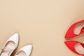 Bright colored high heel women`s shoes on a solid beige background. Flat lay top view Copy space text Royalty Free Stock Photo