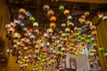 bright colored multi-colored lanterns hang on the ceiling