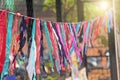 Bright colored ribbons hang and flutter in the wind. Fair holiday festival decoration. India, Goa, Arambol