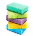 Bright colored sponges for washing dishes, cleaning the bathroom and other household needs are located one above the other. Royalty Free Stock Photo