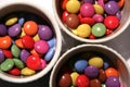 Bright colored sweets in bowls Royalty Free Stock Photo