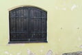 Bright colored wall with window on the medieval streets of Sighisoara Royalty Free Stock Photo