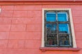 Bright colored wall with window on the medieval streets of Sighisoara Royalty Free Stock Photo