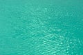 Bright, colorful background close up, turquoise green water surface lake, outdoors. Royalty Free Stock Photo