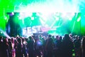 Bright colorful background with the silhouettes dancing young people during the performance favorite musician.